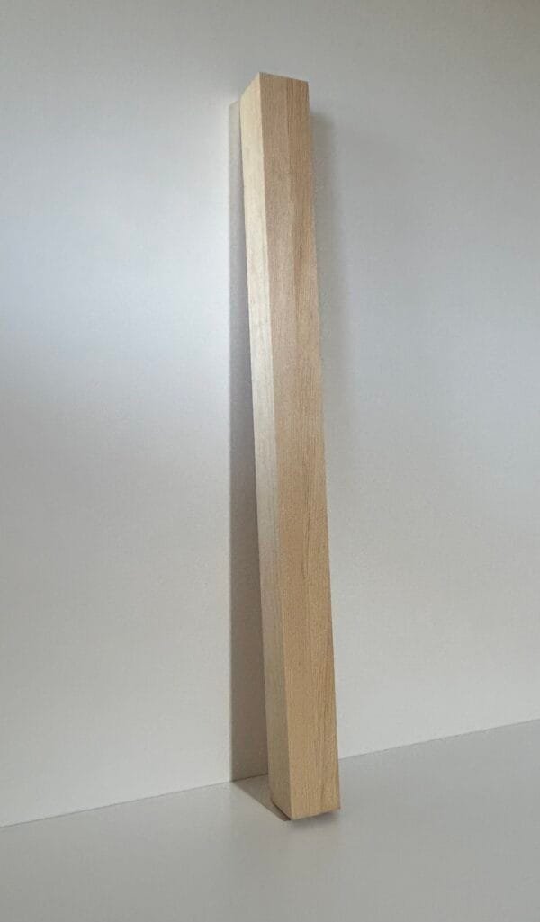 a wooden post in a room